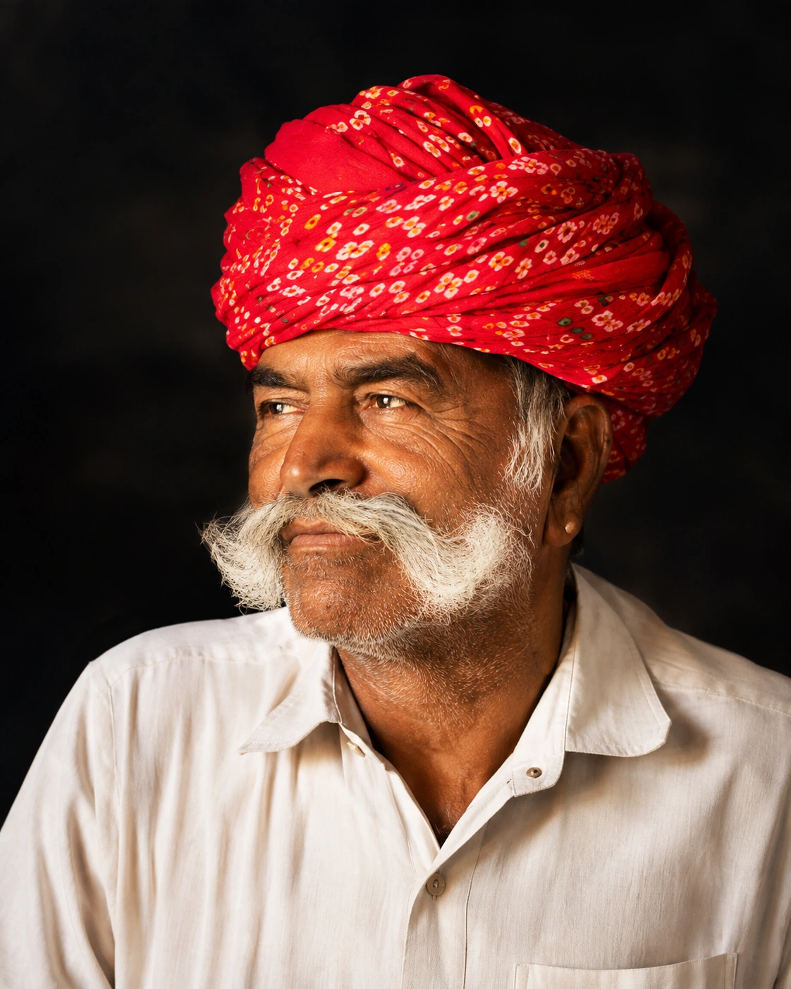 Late Shri Pukhraj Ji Prajapat, founder, wearing a traditional red turban